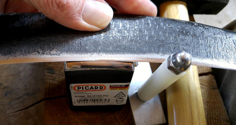 Peening a scythe blade