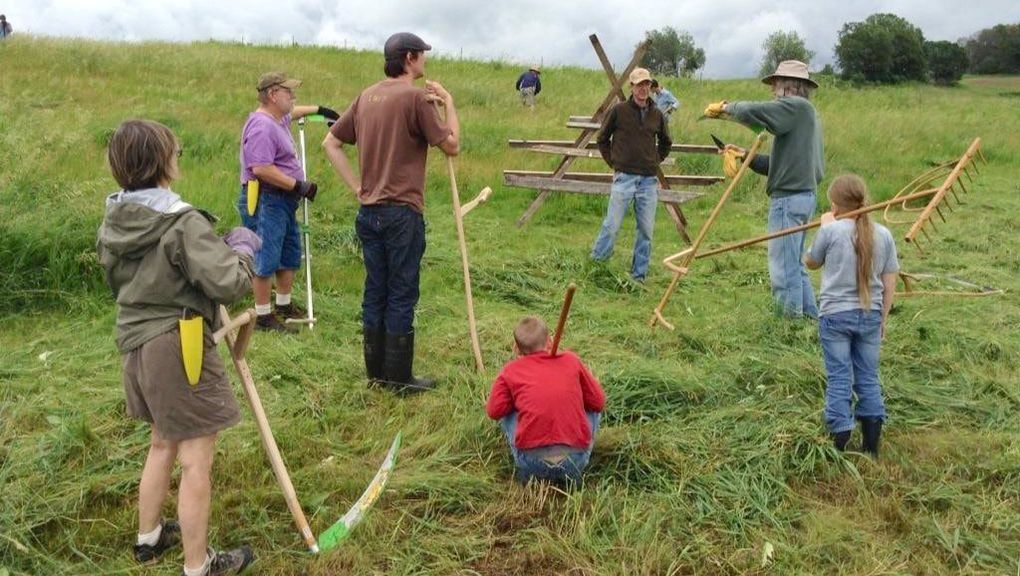 Botan Anderson teaching a scythe workshop.